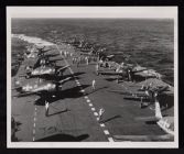 USS Saratoga flight deck with airmen and planes. Jan 1945 